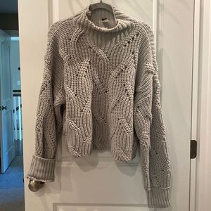 Distressed athletic sweater